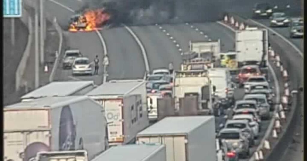 M25 closed near Romford after car fire causes delays